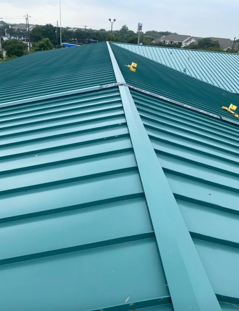 Green commercial metal roof ridge and valley for Metal Roof Repair in Sugarland Run